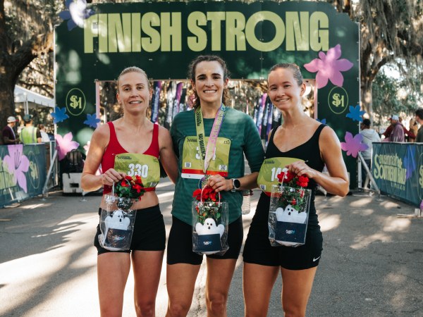 Three finishers with their medals